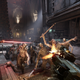 A screenshot of Darktide shows a mob of undead enemies attacking.